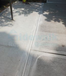 Damaged sidewalk repaired