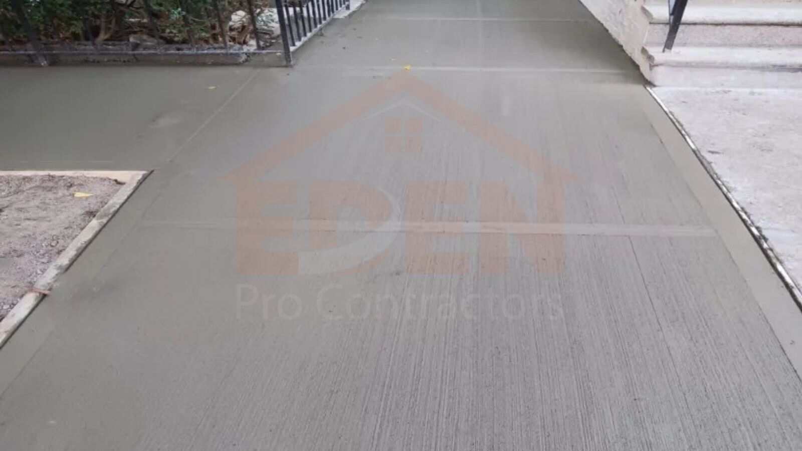 A worker is removing damaged concrete to repair a sidewalk in nyc