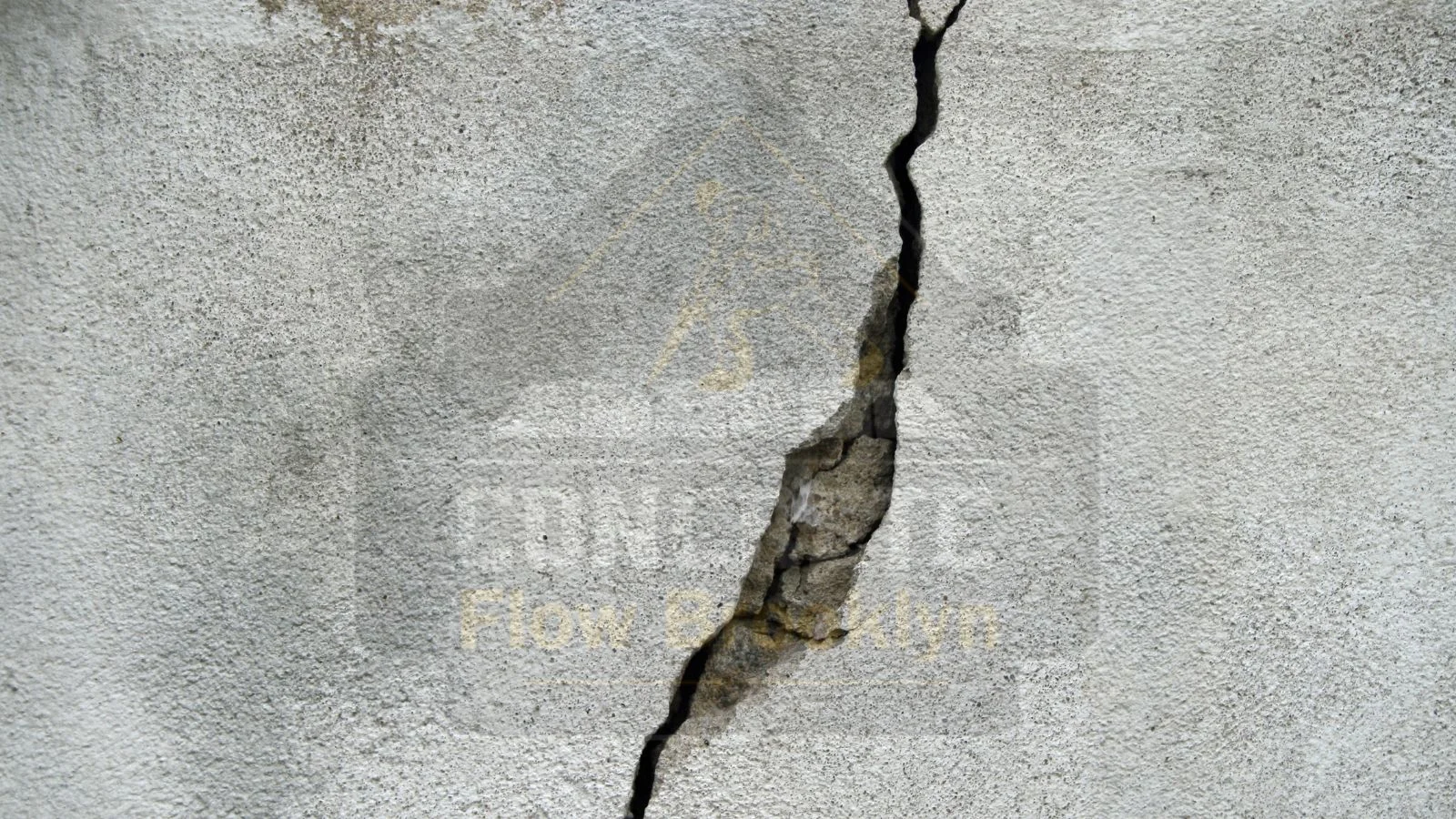 Cracked and damaged concrete showing visible signs of wear, indicating the need for concrete restoration