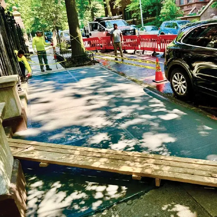Cracked sidewalk in front of the home at 631 2 Street Brooklyn